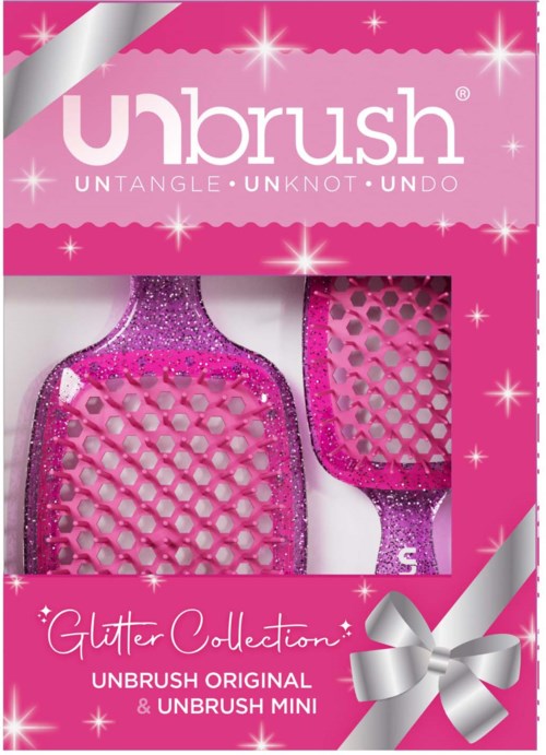 Pinkki glitter-harjaksia, osa Glitter Collectionia, pakkauksessa hopeaisella nauhalla.