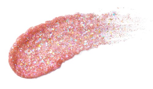 Pink glittery object with a tail, dissolving into particles, shiny and textured.