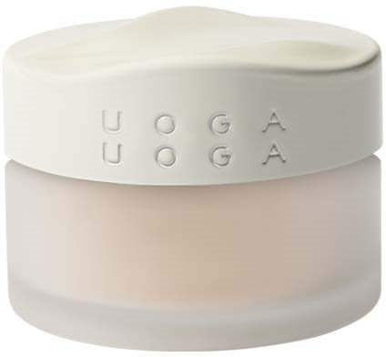 En lille beholder med låg, mærket 'UOGA UOGA'. Den er hvid og rund med enkel design.