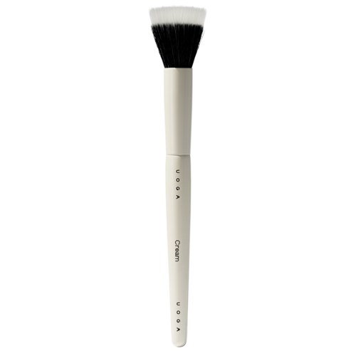A white makeup brush with black bristles, labeled 'Cream,' standing vertically.