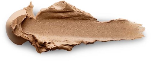 Et lag af beige makeup eller foundation med en rund kant til venstre og en spids kant til højre.