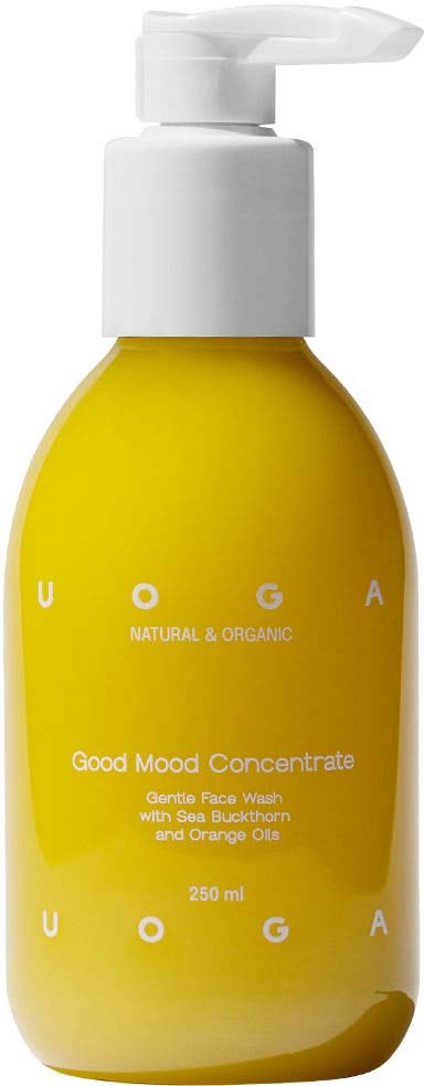 Yellow bottle with a white pump, labeled as 'Good Mood Concentrate' for skin care with orange and seed extracts.