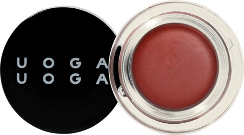 A round lip balm with a black lid that says "UOGA UOGA" and a clear container showing pinkish balm.