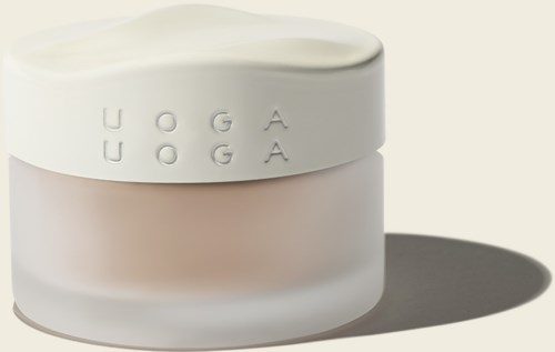 A white jar with a lid, labeled 'UOGA' twice, casting a shadow on a plain background.