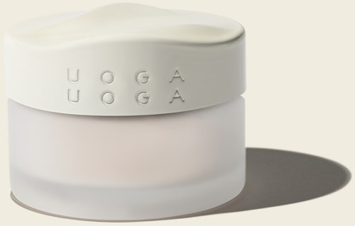 A white container with a lid, the word "OOGA" embossed on the lid, casting a shadow.