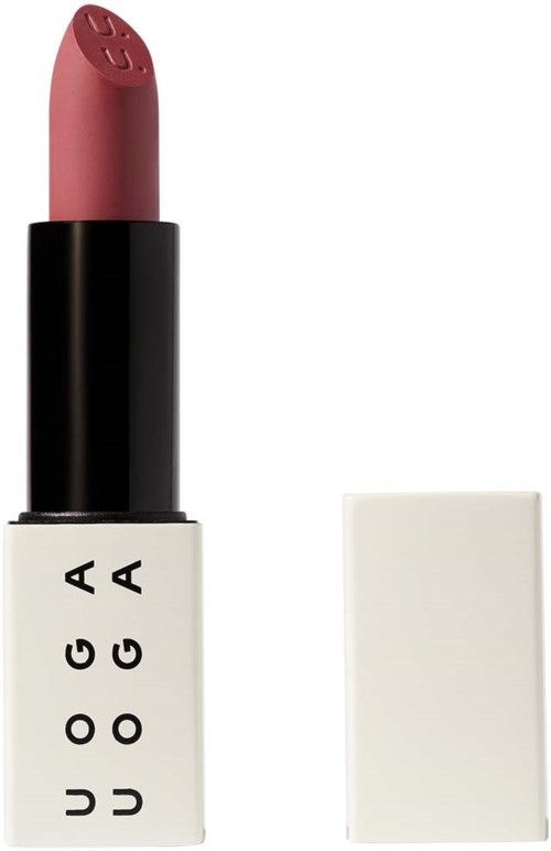 A lipstick in a black and white case with the brand name UUOGA. The lipstick is a soft pink shade.