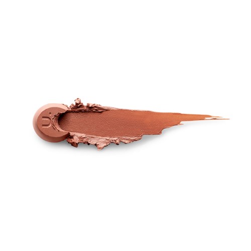 A brown, round makeup product with a brush of blended powdered makeup extending out.