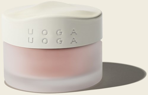 En hvid og pink beholder med indgraverede bogstaver, der kaster skygge. Enkel design, måske en kosmetikbeholder.