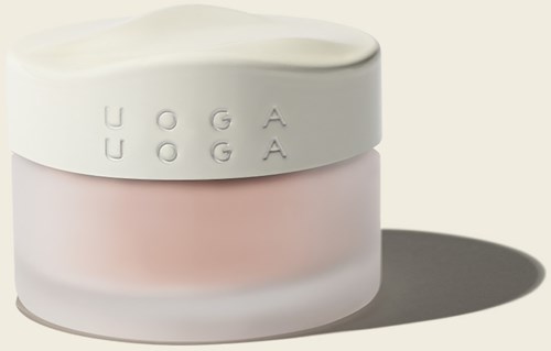 A jar with a white lid, pink body, and embossed letters spelling 'UOGA'.