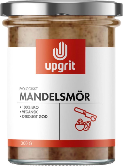 Et glass med mandelsmør med hvit og rød etikett, viser merket Upgrit, økologisk, vegansk, 300 gram.