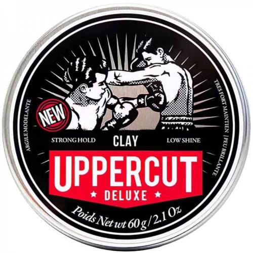 Een sportief ronde logo met twee boksers die vechten, met woorden zoals "NEW" en "UPPERCUT DELUXE" en informatie over het gewicht.