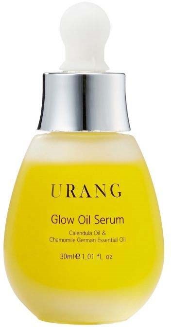 Eine gelbe Tropfflasche mit dem Etikett Urang Glow Oil Serum, weißem Deckel und Silberring.