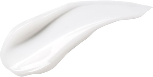 A white cream or lotion spread out in a swirl shape on a black background.