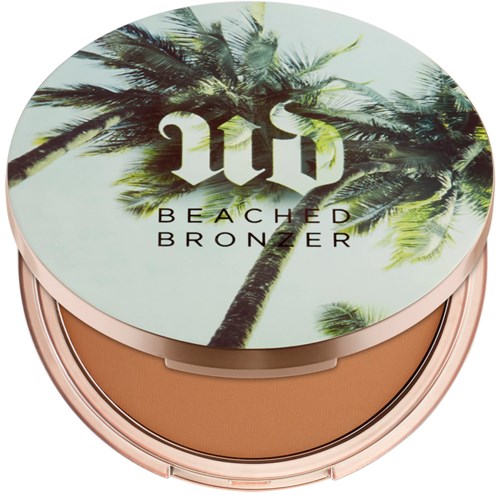 Kompass med palmträd och texten 'UV Beached Bronzer' på ovansidan.