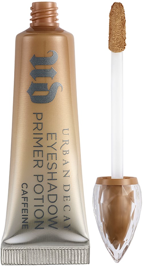 Tub med Urban Decay ögonskuggsprimermedicin med applikator framför, beige färg.