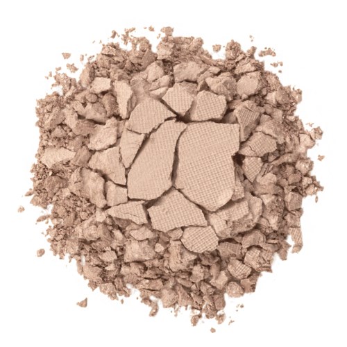 Ein Haufen zerbrochenes, hellfarbenes Pulver und größere Stücke, möglicherweise Make-up oder Backpulver.
