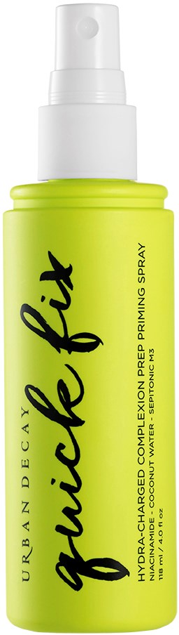 En grønn sprayflaske merket 'Urban Decay Glide Fit' for en forberedelsespray, med en hvit spraymunnstykke.