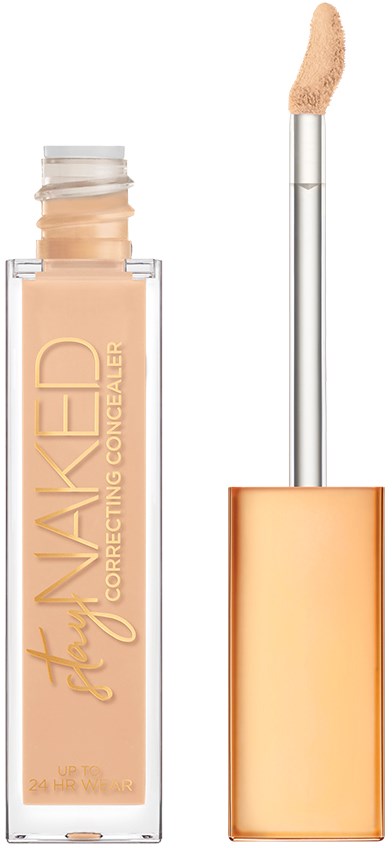 En beige flytande concealer i en genomskinlig tub med applikator och guldlock.