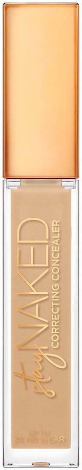 En beige flytande concealer i ett genomskinligt rör med en persikofärgad lock och guldtext.