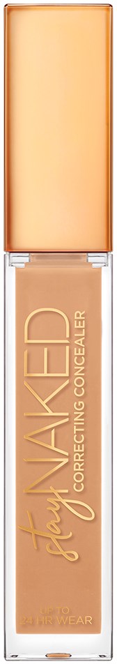En beige concealer i en høj, smal flaske med guldkappe og guldskrift på forsiden.