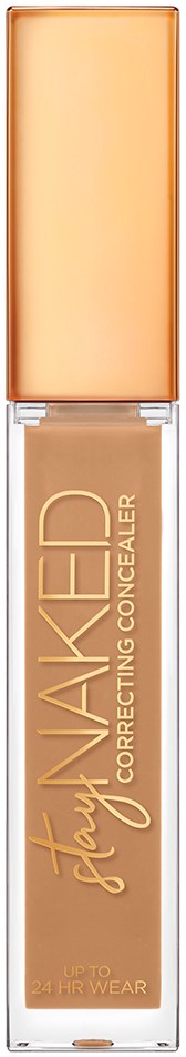 En flaske med foundation-blegning med beige væske indeni, mærket 'Stay Naked Correcting Concealer' og en beige hætte.