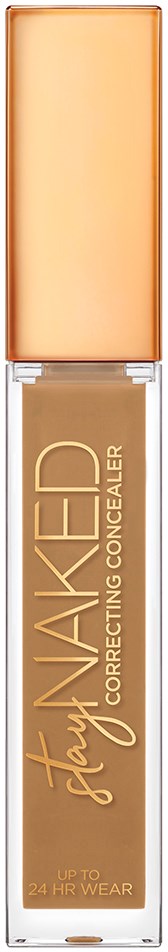 En foundationflaske med beige væske indeni, mærket 'Stay Naked Correcting Concealer' med en lys ferskenlåg.