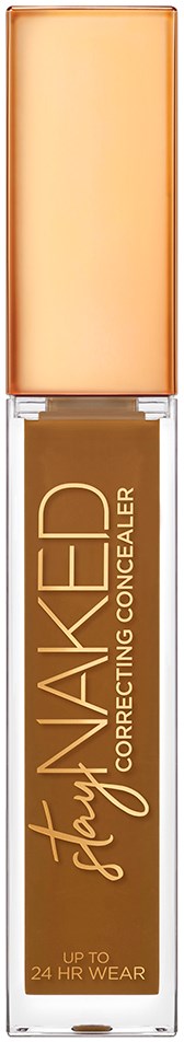 En concealer-emballage med beige låg og gennemsigtig flaske, mærket "Naked" og "Correcting Concealer."