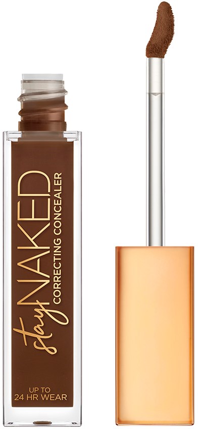 En brun concealer i en gennemsigtig flaske med en applikator og guldklemme.