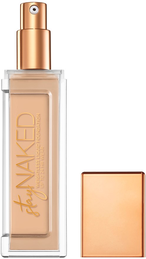 En flaska foundation med pump och utan lock, visar beige vätska inuti. Locket är placerat bredvid.