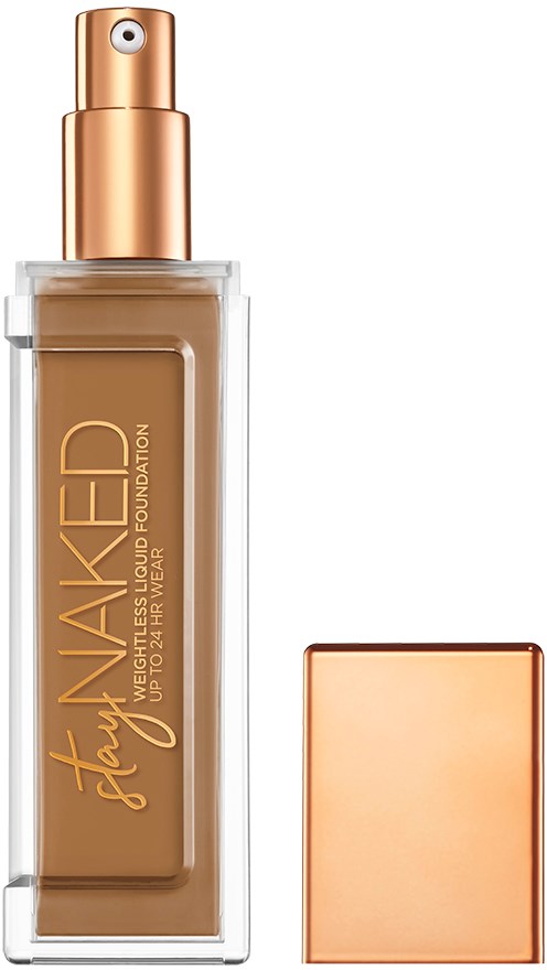 En makeupflaska märkt 'Stay Waked' med spraymunstycke och ett roséguldlock.