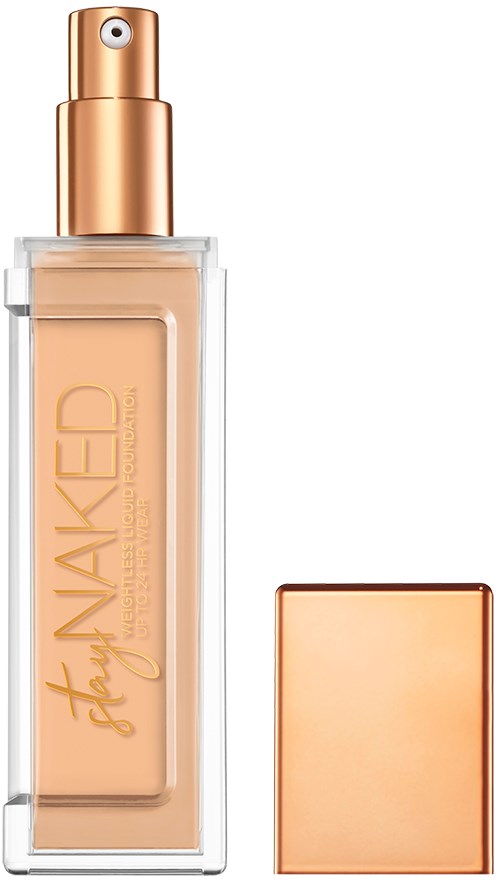 En flaska foundation med spraylock, en genomskinlig behållare och en avtagbar lök i glänsande guld.
