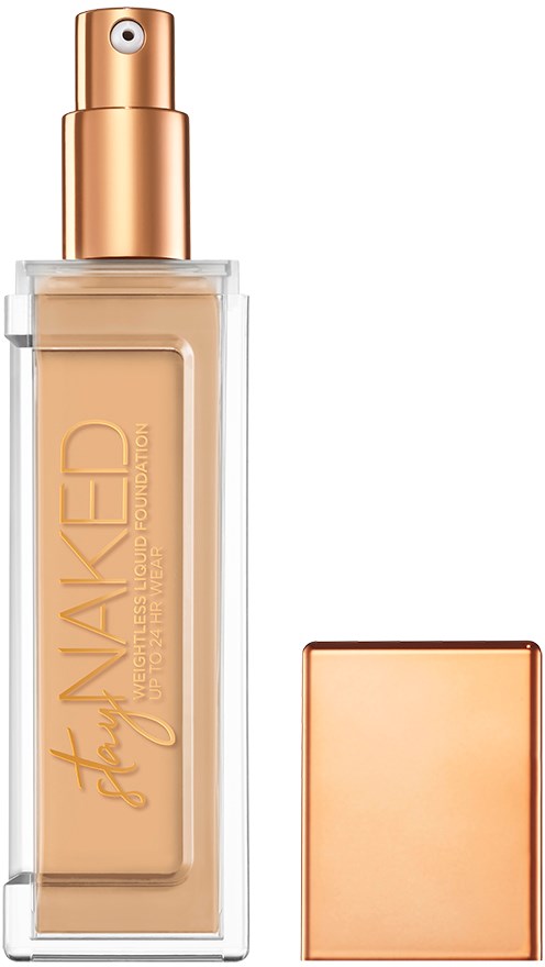 En foundationflaska med spraylock och ett separat fyrkantigt lock, i beige- och roséguld färger.