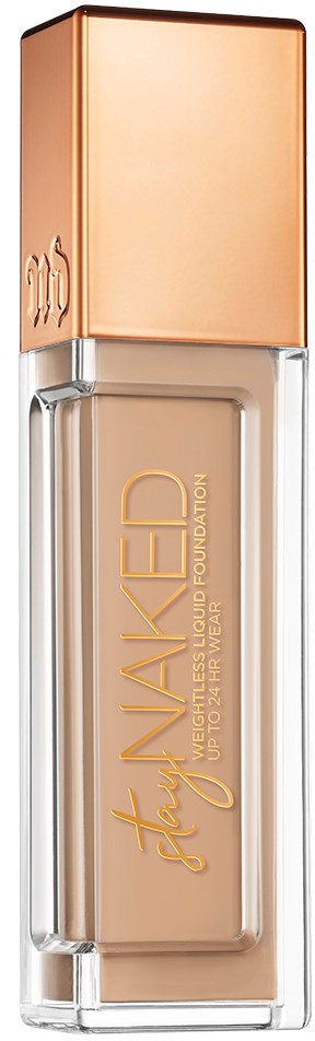 En glasflaska med flytande foundation i beige färg och ett roséguldlock. Etiketten säger "Stay Woke" och "liquid foundation."