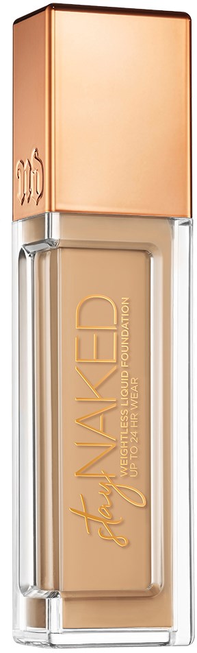 En flaska med ljusbeige flytande foundation och en metallic roséguldig lock.