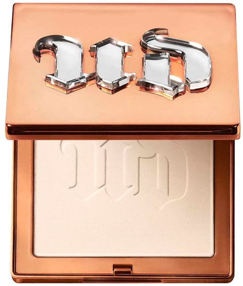 A makeup compact with a mirror-like logo on top and light-colored powder inside.