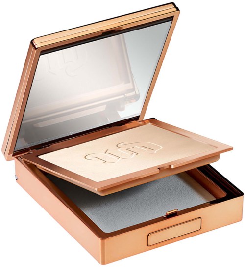 A compact makeup mirror with a built-in light and a powder compartment inside.