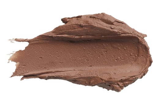En strimma av ljusbrun kräm eller makeup med en slät textur och några bubblor på ytan.