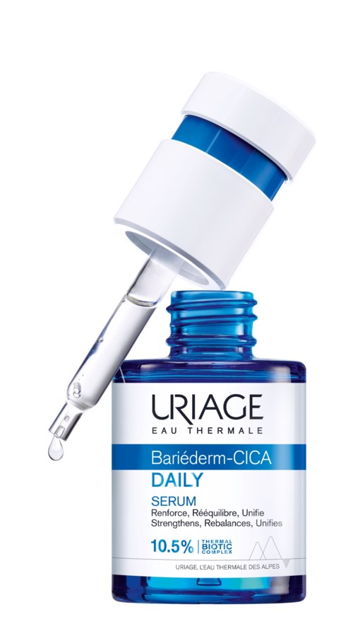 En blå og hvit flaske med pipette, merket Uriage daglig serum for hudpleie.
