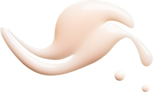 Krämig vit vätska spilld med en böjd form, bildar stänk och små droppar.