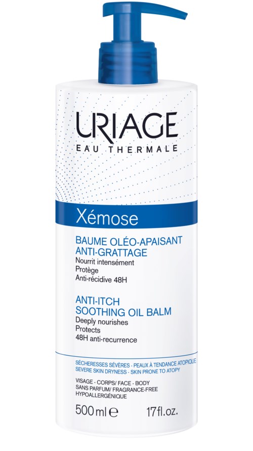 A white and blue bottle of Uriage Xémose soothing oil balm for dry skin with a pump dispenser.