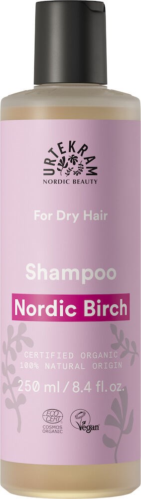 En flaska schampo för torrt hår, med rosa och grå design, innehåller nordisk björk, ekologisk, vegan.