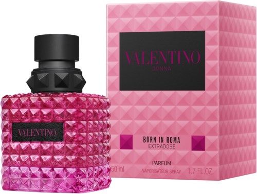 A pink perfume bottle with a textured, pyramid pattern and a matching pink box labeled Valentino Born in Rome Extravoid.