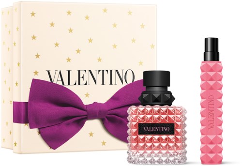 Valentino Parfümset mit großem lila Schleife, zwei Flaschen und sternähnlicher Geschenkbox.