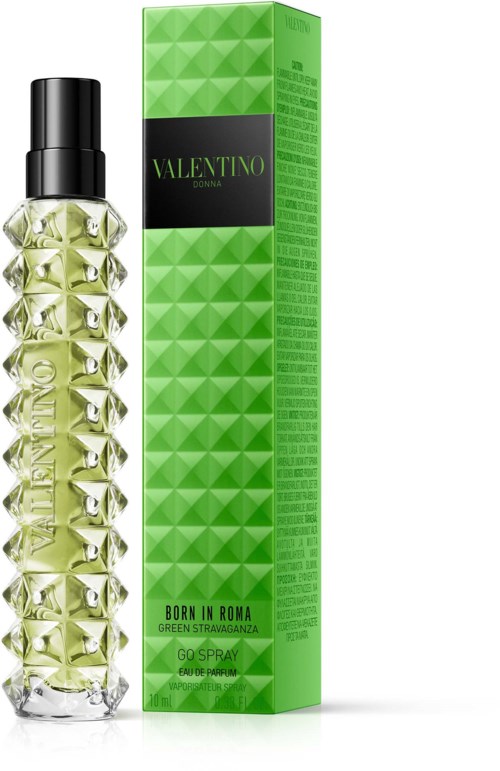 En Valentino parfymeflaske med grønne og sølvdetaljer ved siden av en grønn boks. Flasken har et dekorativt prikkete design.