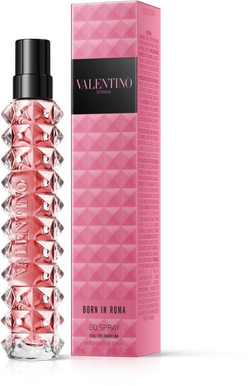 A pink perfume bottle with a diamond pattern next to a matching pink box with brand name Valentino.