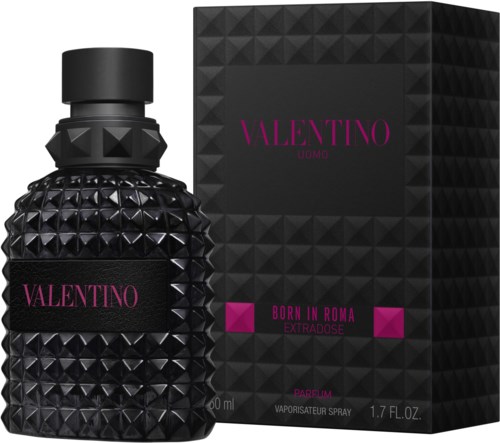 A black bottle with a textured, pyramid surface next to a matching black box with purple text.