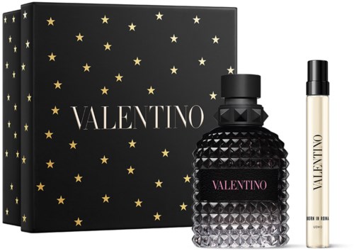 Valentino perfume set with a black bottle, a small spray, and star-designed packaging.