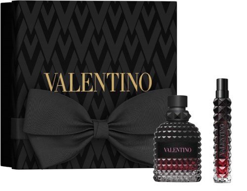 Valentino themed gift set with a large black bow and two perfume bottles with textured designs.