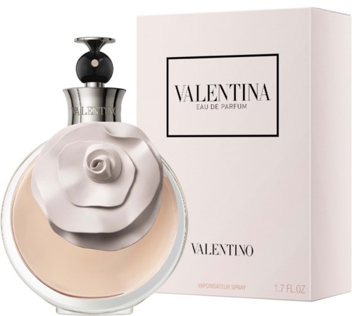 En parfymeflaske med hvit rosedesign og en hvit eske merket Valentina Eau de Parfum av Valentino.