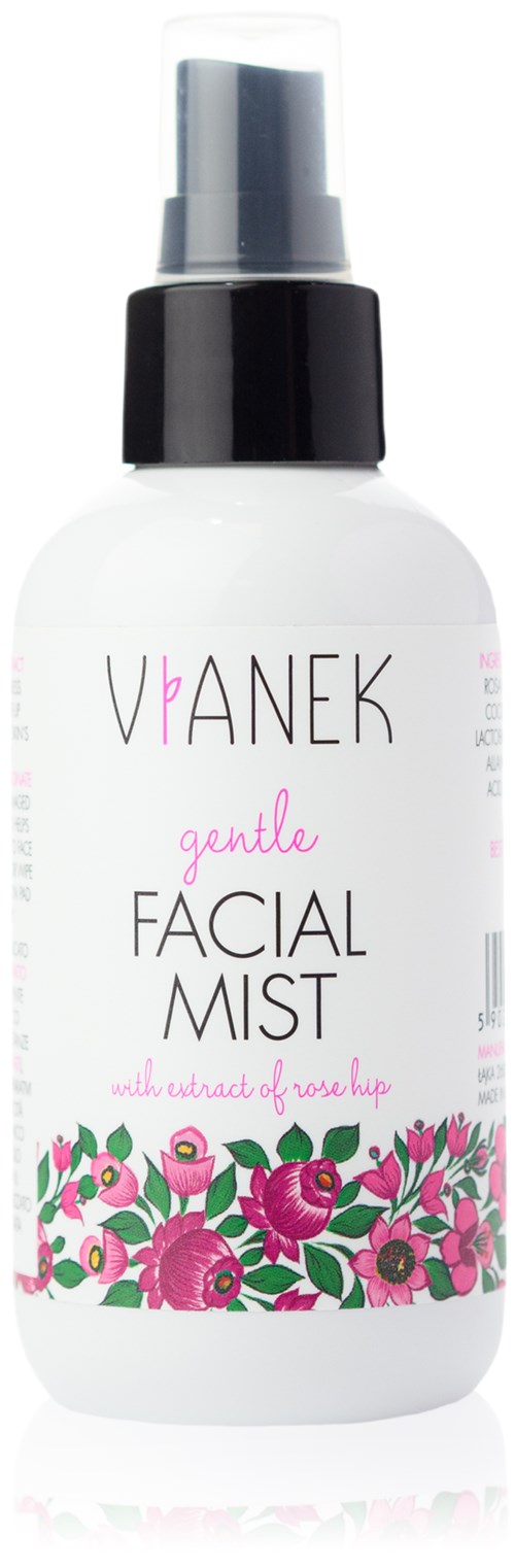 En hvit sprayflaske merket 'VANEK gentle FACIAL MIST' med rosa blomster og svart sprayhode.